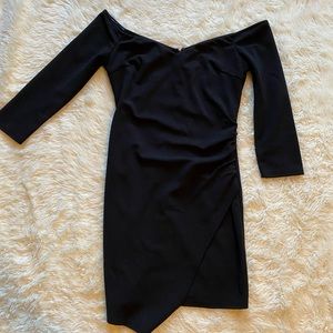 Tight, black, off the shoulder mini dress.